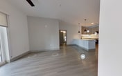 Step into a world of sophistication and style in this meticulously designed 650 square foot apartment. The heart of this urban gem is a breathtaking open-concept kitchen and living area, where culinary dreams come to life. Gleaming stainless steel appliances, including a side-by-side refrigerator and built-in microwave, complement the sleek cabinetry and subway tile backsplash. Ambient under-cabinet lighting creates a warm glow, perfect for both cooking and entertaining.

The living space flows seamlessly from the kitchen, featuring light-toned wood-look flooring that adds warmth and elegance. Large sliding glass doors lead to a private balcony, flooding the room with natural light and offering a picturesque view of the surrounding cityscape. It's the ideal spot for your morning coffee or evening relaxation.

The generously sized 250 square foot bedroom is a serene retreat, boasting plush carpeting and ample space for a king-size bed. A large window bathes the room in soft light, while providing a connection to the outside world. The adjacent closet ensures all your belongings have a perfect place.

Every detail in this home has been carefully considered, from the crisp white walls that serve as a blank canvas for your personal style, to the modern light fixtures that add a touch of sophistication. This isn't just an apartment; it's an opportunity to elevate your lifestyle and embrace the very best of urban living. Welcome home to your personal sanctuary in the heart of the city.