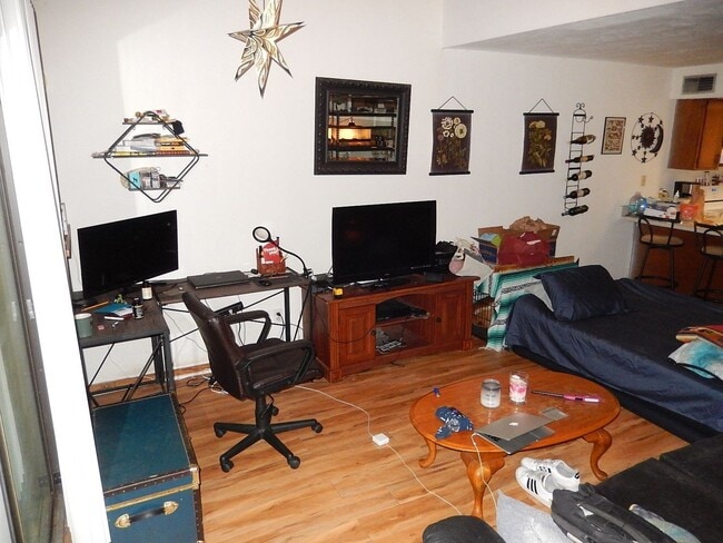 Building Photo - SPACIOUS 1/1 with Deck, Plank Floors, Vaul...