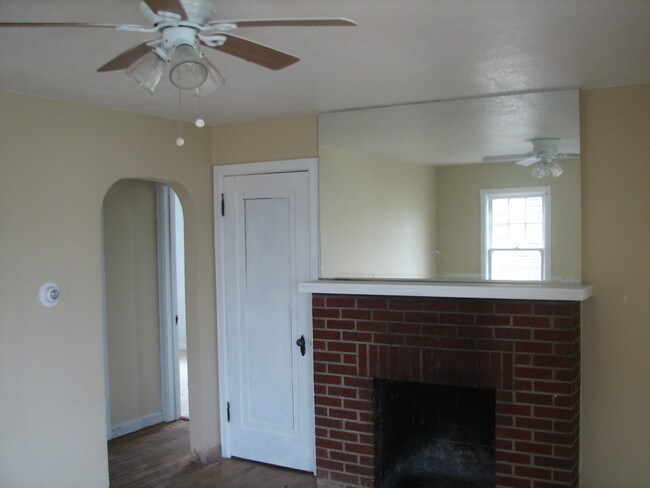 Livingroom w/ Fireplace Upstairs doorway - 3101 South St