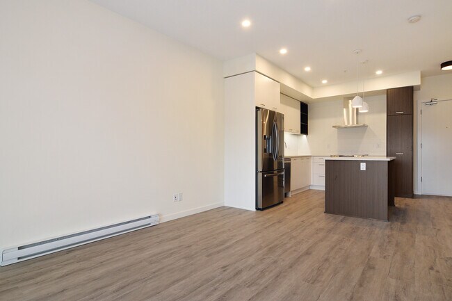 Building Photo - Bright 1 Bed Condo Backing Onto Greenbelt in Park Hill Willoughby Heights