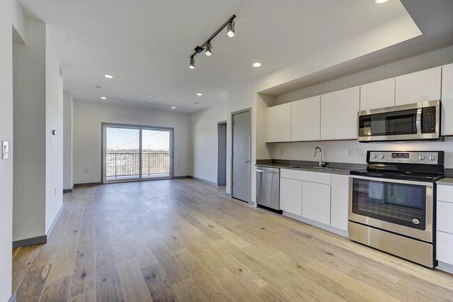 living room with balcony from the entrance - 400 Herron Dr