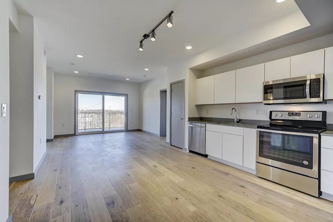 living room with balcony from the entrance - 400 Herron Dr Apartment
