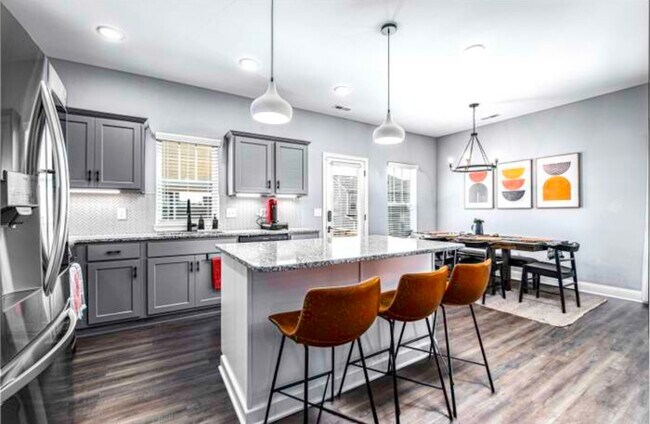 View of Kitchen Island and Dining - 720 Shaker Dr