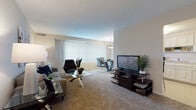 Located at 5303 Northfield Rd in Bedford Heights, Ohio, this single-floor residence offers a thoughtfully designed layout that balances comfort and functionality. The open living area is carpeted and generously sized, featuring large windows dressed with vertical blinds that allow ample natural light to fill the room. The space flows seamlessly into a dedicated dining area, complete with an overhead pendant light fixture, making it well-suited for both casual meals and entertaining. The kitchen is equipped with white cabinetry extending to the ceiling, providing abundant storage, along with a range, dishwasher, and sink set beneath light-toned countertops. Tile flooring in the kitchen adds a practical contrast to the carpeted living spaces. The bedrooms are comfortably proportioned, each with carpeting, windows with vertical blinds, and closet space. One bedroom notably features dual closets, offering excellent storage capacity. The bathroom is clean and functional, finished with white tile surrounding the tub-shower combination, a vanity with an integrated sink, and tile flooring. Throughout the residence, neutral wall tones and consistent finishes create a cohesive and welcoming atmosphere.