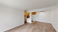 Located at 3902 Annadale Ln in the Arden-Arcade neighborhood of Sacramento, CA, this one-bedroom, one-bathroom unit offers a well-organized, single-level layout. The open living room features durable wood-look laminate flooring, crown molding, and a ceiling fan, while large sliding glass doors flood the space with natural light and provide direct access to an outdoor patio area with green views. A wall-mounted air conditioning unit ensures year-round comfort.

The kitchen connects seamlessly to the living area via a pass-through opening, and is equipped with warm honey-toned wood cabinetry, granite-look countertops, tile flooring, and white appliances including a refrigerator, range, and microwave. Ample upper and lower cabinet storage makes the kitchen both functional and practical.

The bedroom is generously proportioned, finished with plush carpet, crown molding, and a large window fitted with vertical blinds that invite natural light. A sliding closet provides dedicated storage space. The full bathroom includes a combination tub and shower, a wood-vanity with a single sink, a medicine cabinet mirror, and tile flooring, completing the unit with clean and functional finishes throughout.