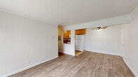 Located at 3902 Annadale Ln in the Arden-Arcade neighborhood of Sacramento, CA, this one-bedroom, one-bathroom unit offers a well-organized, single-level layout. The open living room features durable wood-look laminate flooring, crown molding, and a ceiling fan, while large sliding glass doors flood the space with natural light and provide direct access to an outdoor patio area with green views. A wall-mounted air conditioning unit ensures year-round comfort.

The kitchen connects seamlessly to the living area via a pass-through opening, and is equipped with warm honey-toned wood cabinetry, granite-look countertops, tile flooring, and white appliances including a refrigerator, range, and microwave. Ample upper and lower cabinet storage makes the kitchen both functional and practical.

The bedroom is generously proportioned, finished with plush carpet, crown molding, and a large window fitted with vertical blinds that invite natural light. A sliding closet provides dedicated storage space. The full bathroom includes a combination tub and shower, a wood-vanity with a single sink, a medicine cabinet mirror, and tile flooring, completing the unit with clean and functional finishes throughout.