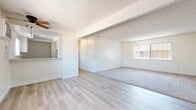 Located at 901 Oxford Dr in Redlands, California, this single-floor, 2-bedroom, 2-bathroom home offers a clean, bright, and functional layout. The open living and dining area is a standout feature, combining light wood-style flooring with plush carpeting and a textured ceiling. A ceiling fan adds comfort, while a large window allows natural light to fill the space, creating an airy and welcoming atmosphere.

The kitchen is efficiently designed with white cabinetry, stone-speckled countertops, light wood-style flooring, and a black gas range with overhead ventilation, offering a practical cooking environment.

Both bedrooms are carpeted and feature sliding or bifold closet doors, providing generous storage. The primary bedroom is a comfortable size with natural light from a window. Each bathroom is finished with white vanity cabinetry, stone-speckled countertops, mirrored medicine cabinets, and light wood-style flooring. The bathrooms include a tub-shower combination, keeping the design clean and functional.

A hallway connects the main living areas to the bedrooms and bathrooms, contributing to a logical and easy-to-navigate floor plan. Throughout the home, a consistent neutral color palette and clean finishes create a cohesive, move-in-ready feel.