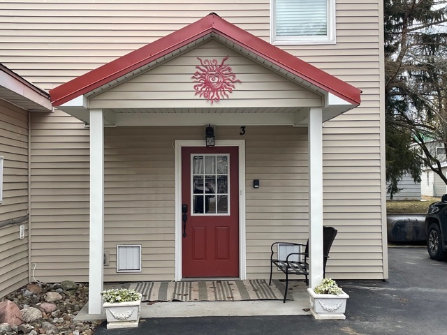 front door is set back from the street - 10 E Washington St