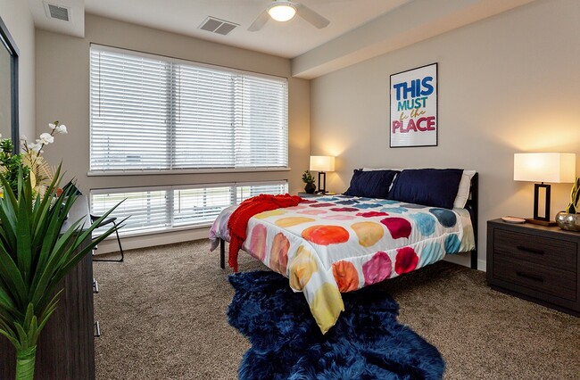 Master Bedroom with Large Windows - Residences at 62W