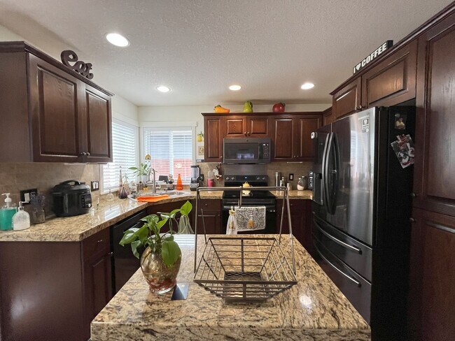 Building Photo - Modern 4-Bedroom Home with Stylish Coffee Bar & Outdoor Pergola Retreat