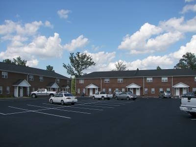 Primary Photo - Rivergate Townhome Apartments