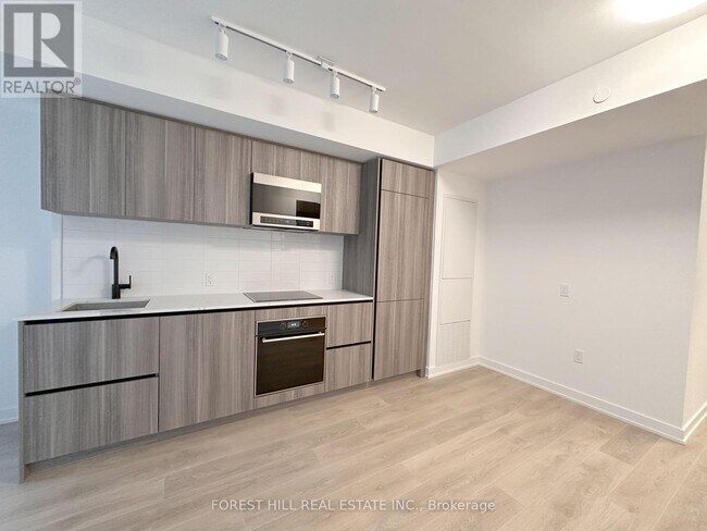 Photo du bâtiment - 117-117 Broadway Ave