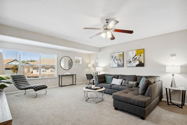 Spacious Living Room w/ Ceiling Fan - Calais Park Apartments