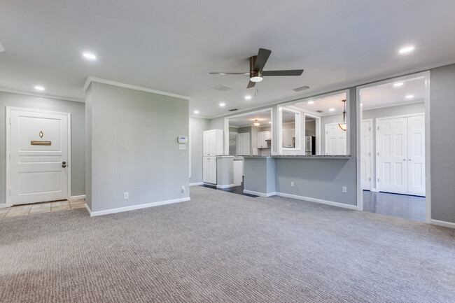 Entry to left. This is more of living room. View into kitchen and dining room - 8738 Glencrest Ln