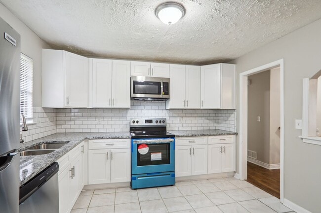 Building Photo - Decatur Living at Its Best: Upgraded Kitchen & Bonus Basement Space