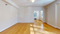 Located at 1431 SW Park Ave in Portland, Oregon, this one-bedroom, one-bathroom unit offers a thoughtfully laid-out single-floor plan. The living and dining areas are bright and open, showcasing warm hardwood floors that run throughout the space. Large windows invite abundant natural light, while classic cast-iron radiators provide character-rich heating. The living room connects seamlessly to the dining area, creating a comfortable flow for daily living.

The kitchen is a standout feature, complete with white cabinetry, open shelving, and a bold black-and-white checkered tile floor that lends a timeless, vintage aesthetic. A stainless steel refrigerator and range are included, with ample counter and storage space neatly arranged.

The bedroom is a well-proportioned retreat bathed in natural light from a street-facing window. Multiple closets — three in total throughout the unit — offer exceptional storage for the space. The bathroom features a full soaking tub with shower, white square tile walls accented by pink tile trim, and a window that brings in soft, diffused light.

A hallway connects the main rooms efficiently, completing the sensible layout. With its classic architectural details, hardwood floors, and charming vintage touches, this Portland unit delivers a warm and functional living environment.