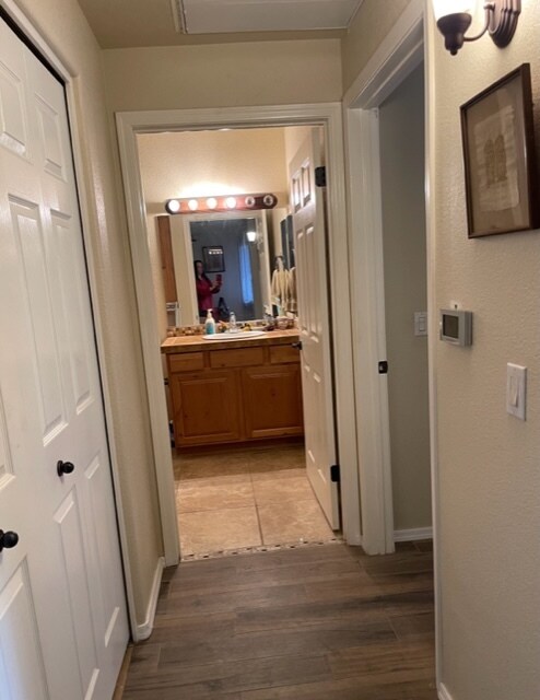 Hallway to 2nd bath/laundry closet to left - 7050 E Sunrise Dr