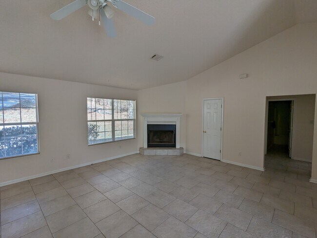 Living room with fireplace - 115 Tam O Shanter Ct