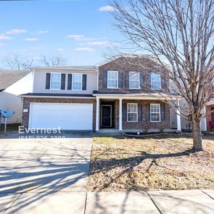 Primary Photo - Spacious 4-Bedroom Home with Modern Amenit...