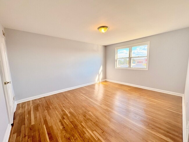 Building Photo - Charming Brick Home with Finished Basement, Modern Kitchen & Spacious Yard