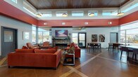 Located at 271 Pearl Rd in Brunswick, Ohio, this single-floor space presents a striking contemporary design defined by bold terracotta-red accent beams, warm wood-paneled ceilings, and large floor-to-ceiling windows that flood the interior with natural light and offer views of the surrounding outdoor areas. The open-concept layout is anchored by a stylish lounge area furnished with rich burnt-orange sofas and accent chairs arranged around a decorative tiled fireplace topped with a wall-mounted flat-screen television, creating an inviting focal point. Clerestory windows positioned along the upper walls enhance the sense of volume and allow additional daylight to permeate the space throughout the day. A dedicated seating nook near the expansive windows features mid-century-inspired chairs paired with a small side table, offering a quieter setting. A casual dining area with a wooden high-top table and upholstered chairs sits adjacent to the main lounge, complemented by contemporary artwork mounted on the walls. The fully equipped kitchen includes stainless steel appliances, ample cabinetry, dark countertops, and a generous island with bar seating. Tile flooring with varied inlay patterns flows throughout, unifying the space. Access to an outdoor patio area with seating is available through glass doors, extending the usable space outdoors.