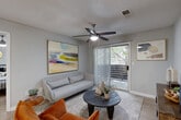 Located at 4659 Dawson Blvd in Atlanta, GA, this well-appointed 2-bedroom, 2-bathroom single-floor home offers a smart, functional layout with modern finishes throughout. Light wood-tone flooring flows seamlessly across the living areas and hallway, creating a warm and cohesive aesthetic.

The living room is a comfortable gathering space featuring a ceiling fan, textured ceiling, and a sliding glass door that opens to a private outdoor balcony, filling the room with natural light and providing a pleasant outdoor connection. Adjacent to the living room is a cozy dining area with space for intimate meals.

The kitchen is well-equipped with stainless steel appliances, a subway tile backsplash, ample cabinetry, and a generous white quartz countertop with an undermount double sink — ideal for both everyday cooking and entertaining.

The two bedrooms are bright and serene, each with windows that invite natural light and ceiling fans for comfort. Three closets provide generous storage throughout the home. Both bathrooms are clean and modern, with one featuring a wide vanity, white countertop, and a framed mirror with contemporary lighting.

A dedicated laundry area with in-unit washer accommodates everyday convenience, while a utility room adds additional functionality. The overall ambiance is calm, contemporary, and move-in ready.