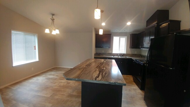 Open kitchen/dining area with large island feature tons of storage. Kitchen is all energy star rated - 3626 Sea Mist Ave