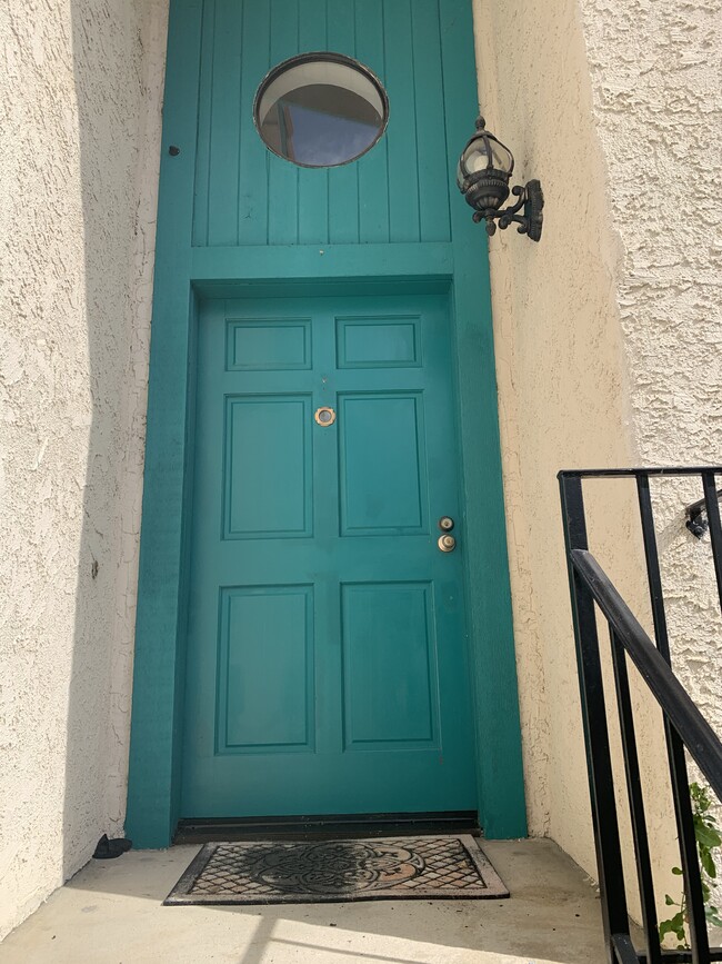 Front door with brass eye spec - 5246 Calderon Rd