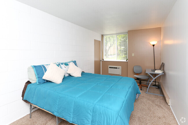 1BR, 1BA Flat - Bedroom - The Quads Apartments