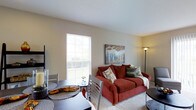 Located at 4426 Calderwood Drive in Columbus, Ohio, this two-story home offers a welcoming and well-organized layout designed for comfortable everyday living. The main level features an open living and dining area that flows naturally together, creating a versatile space ideal for both relaxing and entertaining. Large windows allow generous amounts of natural light to fill the room, brightening the neutral-toned walls and light carpeting that run throughout. The living area is warm and inviting, with enough space to accommodate comfortable seating and decorative accents that add character to the room. The dining area sits adjacent to the living space, making the layout practical and connected. The overall interior palette is soft and neutral, contributing to a calm, easy-to-personalize ambiance. Spread across two floors, the home provides separation between living and private spaces, a thoughtful design feature that enhances both function and comfort. The exterior setting in a residential Columbus neighborhood adds to the home's appeal, with views of the surrounding greenery visible through the windows. Overall, this property delivers a solid, move-in-ready living experience in a well-established Ohio community.