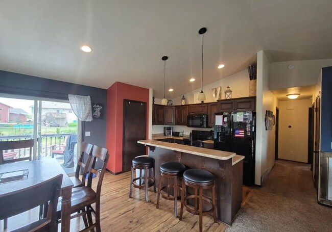 Building Photo - Spacious 4BR Home with Walkout Deck & Attached Garage!