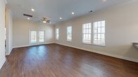 Located at 512 Murray Park Loop in Myrtle Beach, SC, this single-story home offers a clean, modern aesthetic throughout. Warm hardwood-style flooring flows consistently across the main living areas and bedrooms, complemented by crisp white trim and neutral wall tones that create a bright, welcoming atmosphere.

The kitchen is a standout feature, showcasing white shaker-style cabinetry, granite countertops, stainless steel appliances, and a central island with pendant lighting overhead. Natural light pours in through multiple windows fitted with white blinds, enhancing the open feel of the space.

The bedrooms are generously proportioned, each featuring ceiling fans, ample closet space with bifold doors, and windows that bring in natural light. The primary bathroom is equipped with a framed glass-enclosed shower, granite vanity countertop, white cabinetry, and tile flooring. A second full bathroom mirrors this quality with a tub/shower combination, granite vanity, and matching tile floors.

Additional details include crown molding in select areas, recessed lighting, and a functional layout with well-defined living spaces. The entryway features a classic six-panel door, setting a polished tone from the moment of arrival. Overall, the home presents a cohesive, move-in-ready interior with quality finishes throughout.