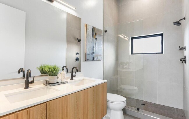 Building Photo - Sophisticated two-bedroom condo with ample...