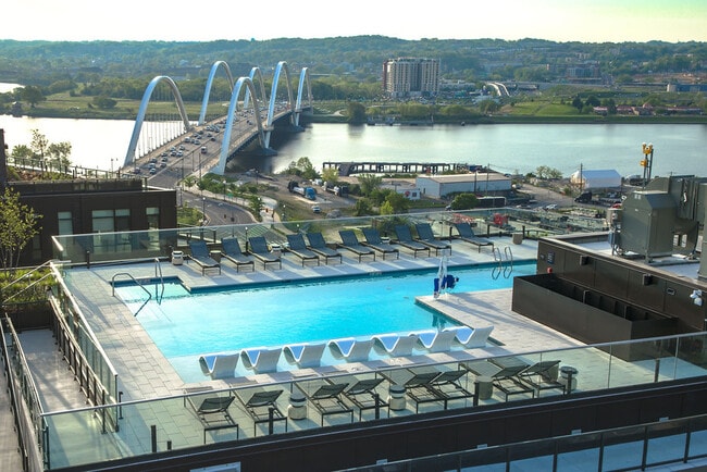 Rooftop pool with sweeping views of Buzzard Point's waterfront. - Vermeer Apartments