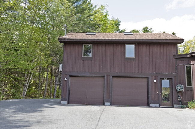 Upstairs apt over garage; front windows & 2 skylights; entrance door partially shows on right - 64 Gardner Rd