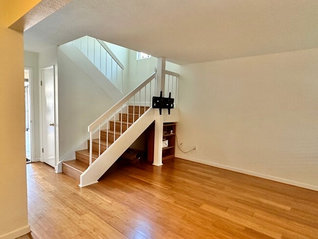There is a storage closet under the stairs. Guest bath across the hallway from the stairs. - 9505 Easter Way