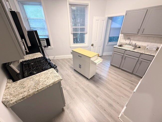 Kitchen comes with island - 2432 E Norris St