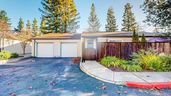 Foto del edificio - Cozy 1 bedroom 1 bath end unit condo with 1 car garage and private patio located next to Peterson...