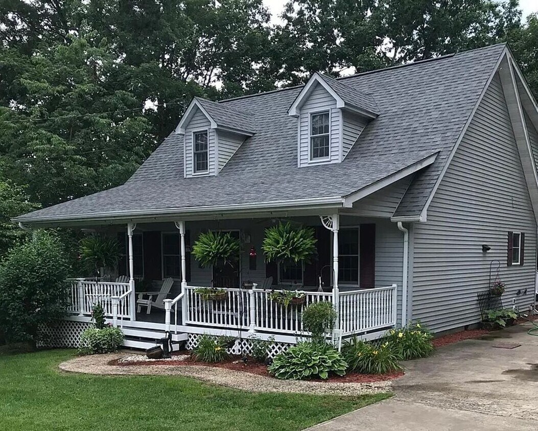 Primary Photo - Two Story Cape Cod located in country sett...