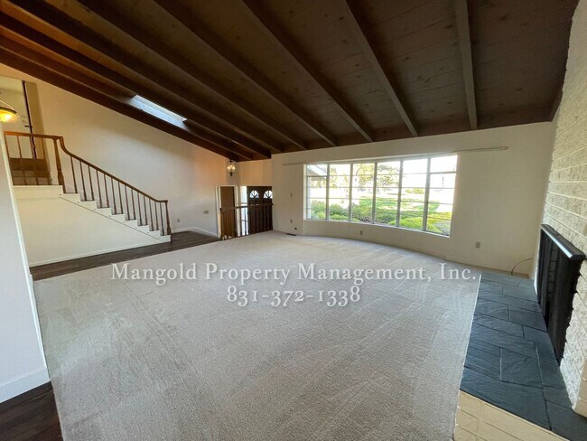 Building Photo - Beautiful 4-bed 2-bath Home with Cozy Fireplace, Front and Back Yards and Large Windows!