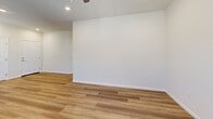 Located at 4285 Astoria St in Sacramento, CA, this single-story 2-bedroom, 2-bathroom home offers a clean, modern design with consistent wood-look flooring throughout. The open kitchen and living area form the heart of the home, featuring rich warm-toned cabinetry, granite countertops, stainless steel appliances including a side-by-side refrigerator, dishwasher, and range, as well as recessed lighting and multiple windows that allow natural light to fill the space. The living area flows seamlessly from the kitchen, offering a generous, open feel with a ceiling fan and recessed lighting overhead. Both bedrooms are comfortably sized, with neutral walls, wood-look flooring, natural light from blinded windows, and ample closet space — the primary bedroom includes a sliding double-door closet. The two bathrooms are finished with the same warm cabinetry and granite countertops found in the kitchen. One bathroom features a shower-tub combination with built-in shelving, while both include brushed nickel fixtures and wood-look flooring. The overall aesthetic is cohesive and neutral, making the home move-in ready with a clean, contemporary feel throughout.