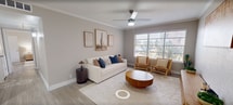 This 790 sq ft, single-floor apartment in Euless, TX offers 2 bedrooms and 3 bathrooms across a well-planned layout. Light-toned luxury vinyl plank flooring flows throughout, complementing the neutral wall palette and white trim. The living room is a bright, welcoming space featuring crown molding, a ceiling fan, and a large window that invites natural light and outdoor views. The galley-style kitchen is equipped with white shaker cabinets, quartz countertops, a subway tile backsplash, stainless steel sink, and black appliances including a range and refrigerator. The primary bedroom spans 200 sq ft and includes a ceiling fan, a built-in closet, and easy access to a private bathroom. The second bedroom also features a ceiling fan and a natural-light window. All three bathrooms are finished with white vanities, quartz countertops, brushed nickel hardware, and wood-look flooring. A hallway connects the private sleeping quarters to the shared living areas, and a dedicated closet provides additional storage. The overall ambiance is clean, modern, and cohesive, making this apartment a comfortable and functional home.