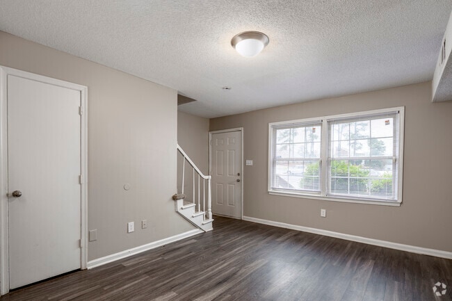 2BR, 1.5BA - 985SF - Living Room - Retreat at Broad River Apartments