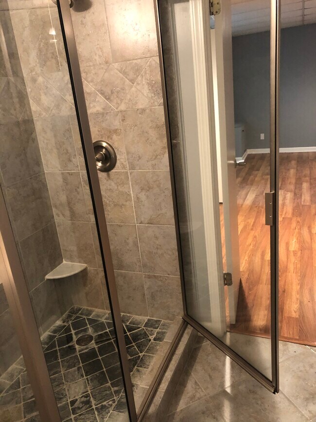 New bathroom with tiled shower. - 4622 Kings Down Rd