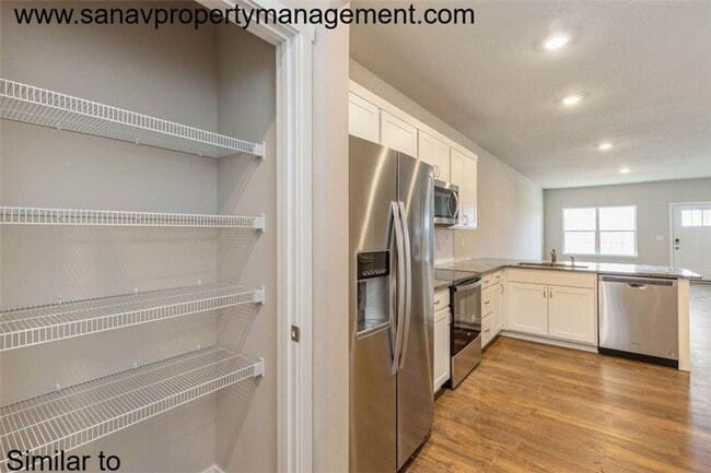 Building Photo - "Charming 2-Bedroom Home in Exclusive 36 W...