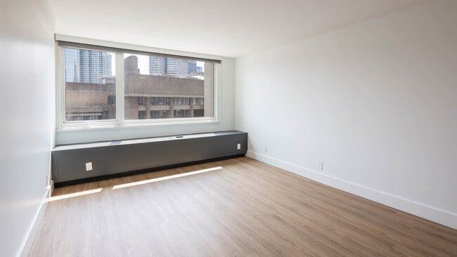 Bedroom with Hard Surface Flooring - The Towers at Longfellow Apartments