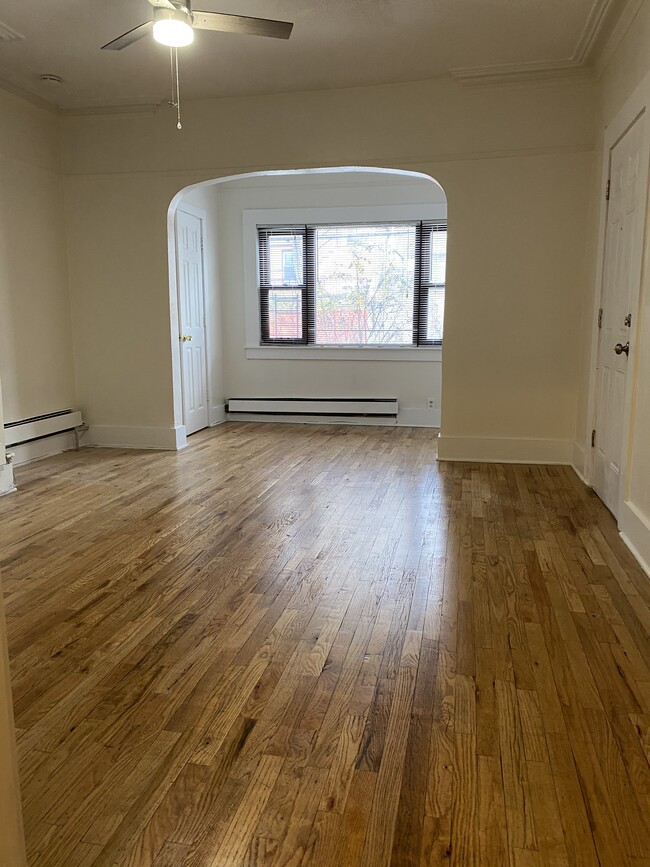 sunny living room beautiful hardwood floors - 27 Linden St