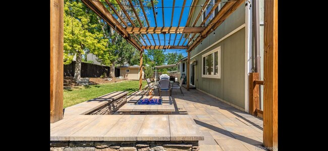 Outdoor fireplace - 11011 E Fair Cir