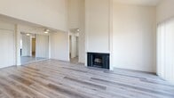 This contemporary 830 square foot apartment in Los Angeles offers a blend of style and functionality. The open-concept living area is the heart of the home, featuring a striking fireplace and sliding glass doors that lead to a private balcony, flooding the space with natural light. The kitchen boasts modern appliances, crisp white cabinetry, and a practical breakfast bar, ideal for casual dining or entertaining.

Both bedrooms are generously sized, with the primary bedroom measuring 150 square feet. The two full bathrooms are outfitted with clean lines and modern fixtures, including spacious vanities and ample storage. Throughout the apartment, wood-look flooring adds warmth and continuity to the space.

Additional features include a window-mounted air conditioning unit for comfort, a walk-in closet for added storage, and a convenient in-unit laundry area. The apartment's single-story layout and thoughtful design maximize the use of space, creating a comfortable and efficient living environment. Located in a desirable area of Los Angeles, this apartment offers a perfect blend of urban convenience and modern comfort.
