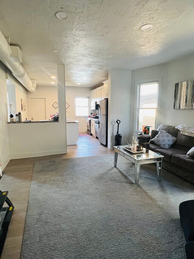 Open concept living area and kitchen - 128 Cohassett St